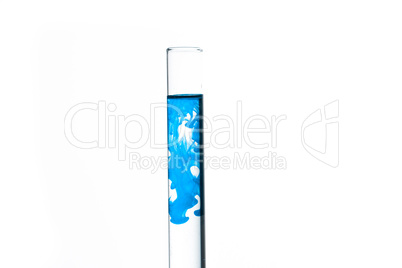Test tube of water with blue paint