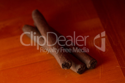 Three cigars on a table