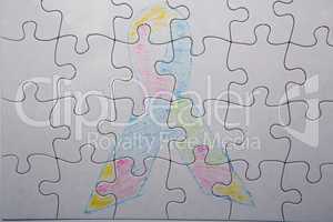 Crayon drawing of autism and aspergers ribbon