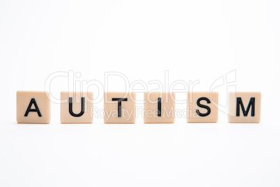 Autism spelled out in plastic letter pieces
