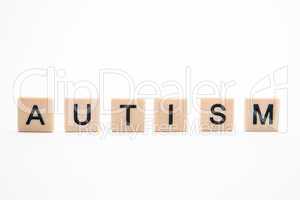 Autism spelled out in plastic letter pieces
