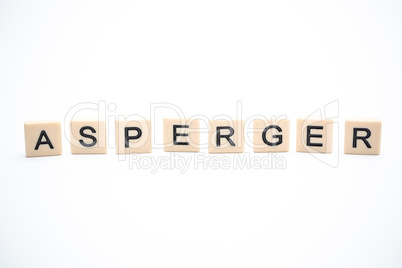 Asperger spelled out in plastic letter pieces