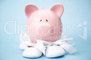 Piggy bank wearing baby booties