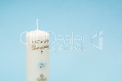 Christening candle with blue detail and copy space