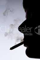 Close up silhouette of smoking man