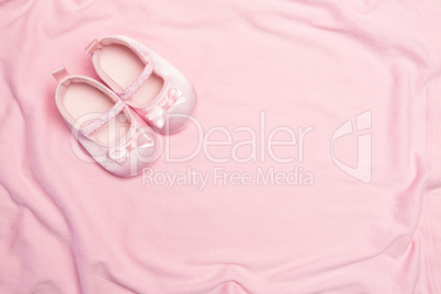 Pink blanket and baby slippers