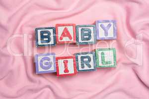 Baby girl spelled out in blocks
