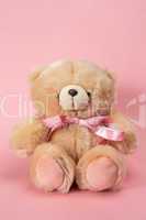Teddy bear with pink ribbon