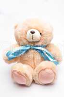 Teddy bear with blue ribbon