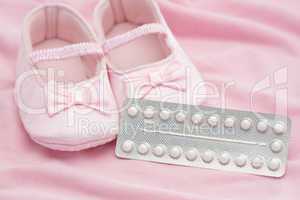 Contraceptive pill packet with baby booties