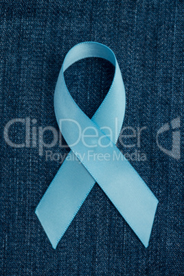 Blue ribbon for prostate cancer awareness on demin