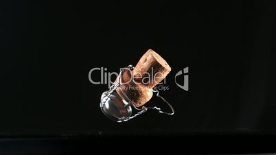 Champagne cork falling and bouncing