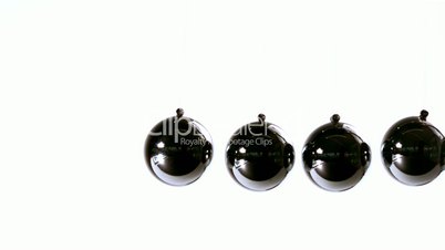 Newtons cradle on white background