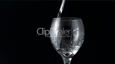 Water pouring into wine glass