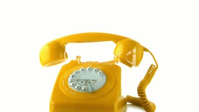 Receiver falling on yellow dial phone