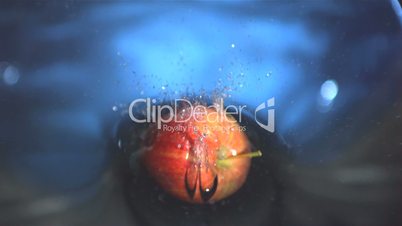 Apple falling into water