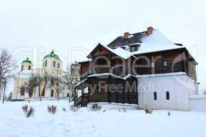 the wooden house and beautiful church in winter