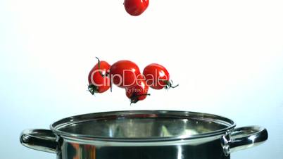 Cherry tomatoes falling in pot