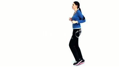 Brunette jogging in tracksuit