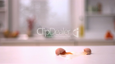 Egg smashing on kitchen counter