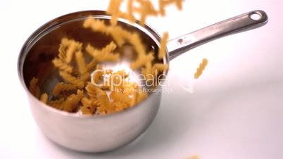 Fusilli falling into pot