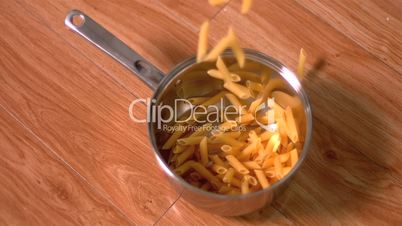 Penne falling into pot