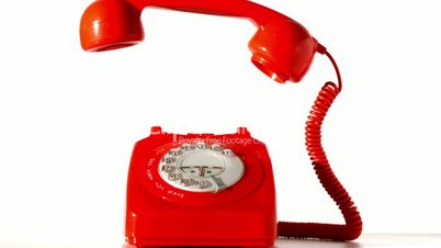 Receiver falling onto red dial phone on white background