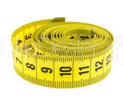 Curled yellow measuring tape