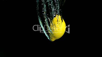 Lemon falling in water