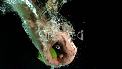 Hand taking lime from water