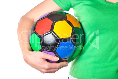 Colored soccer ball in a girl's hand