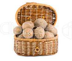 Raw potatoes in a basket