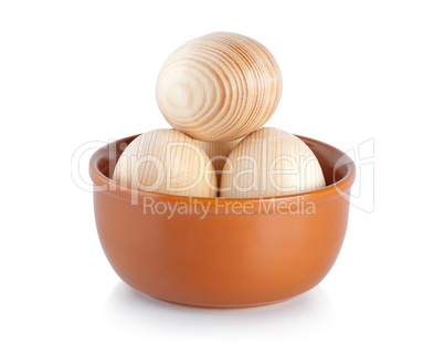 Wooden easter eggs in a plate