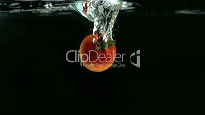 Tomato falling into water