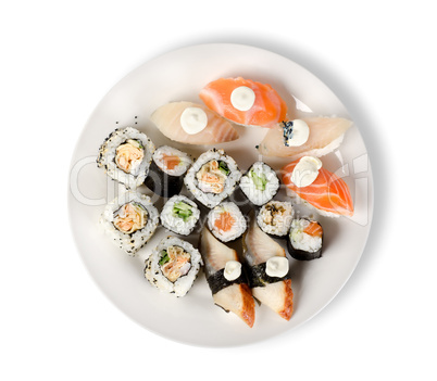 Sushi and rolls in a plate isolated