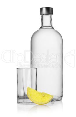 Bottle of vodka and lemon isolated
