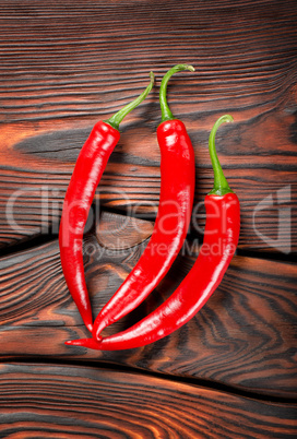 Three red chili peppers