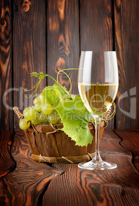 Glass of white wine and grapes