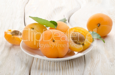 Apricots in a white plate