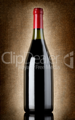 Bottle of wine on the old background