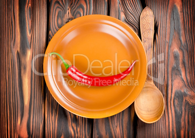 Pepper in a plate and spoon
