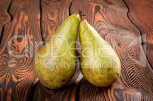 Two pears wooden on an background