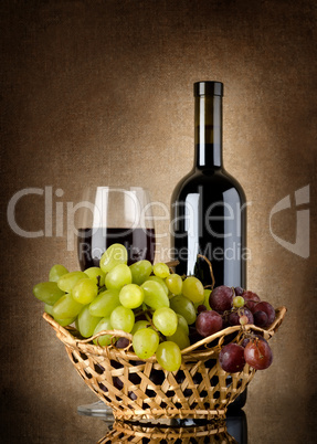Wine and grapes in basket