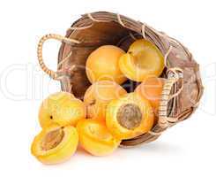 Ripe apricots in a wooden basket