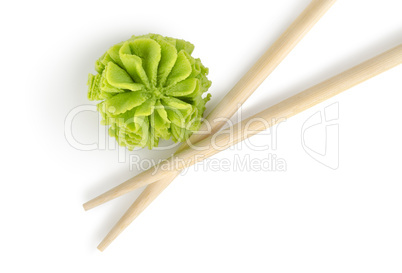 Wooden chopsticks and wasabi isolated