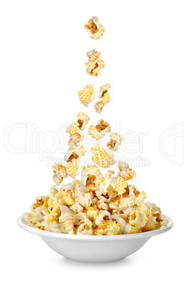 Popcorn falling in the plate