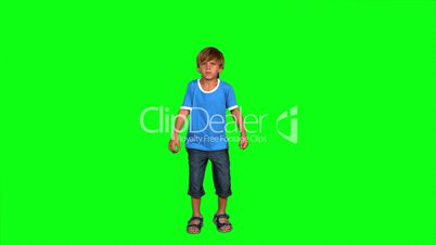 Boy jumping on green screen