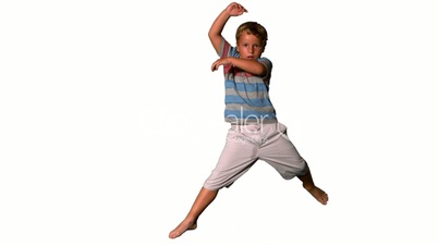 Boy jumping up on white background