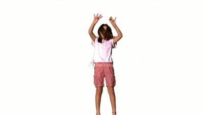 Girl jumping up on the white background