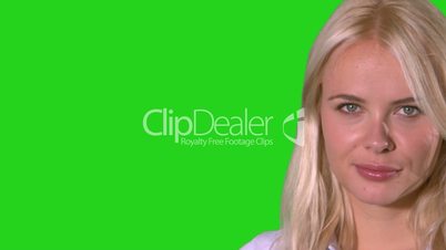 Pretty blonde woman smiling on green screen